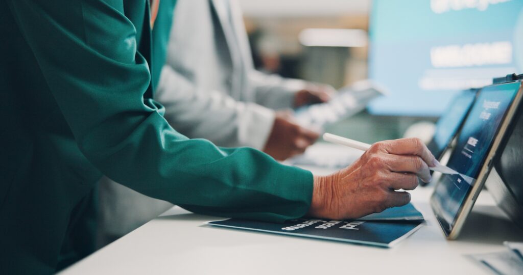 Welcome booth, convention and tablet sign in at expo for summit, information or showcase. Product e